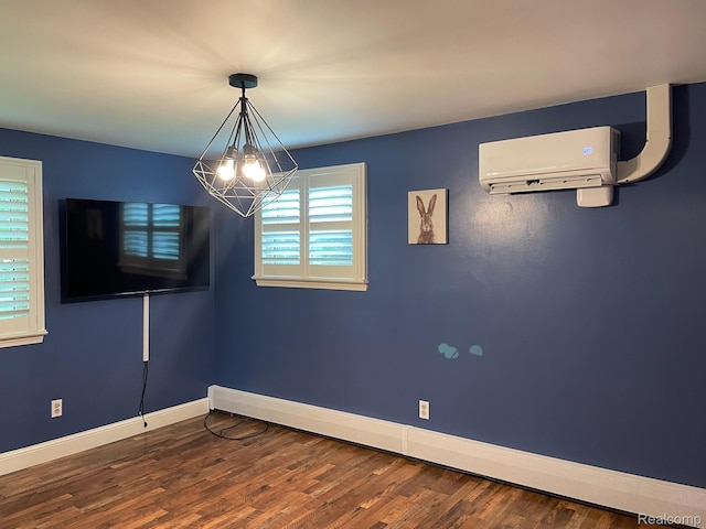 21150 E Chigwidden St, Northville, MI 48167 - spare room with a wall mounted air conditioner, a chandelier, dark wood-type flooring, and a baseboard heating unit