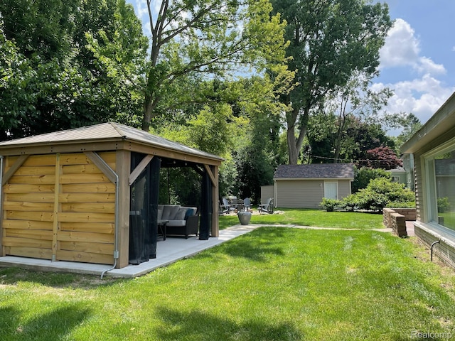 21150 E Chigwidden St, Northville, MI 48167 - view of grassy yard with a gazebo, an outbuilding, and a patio area