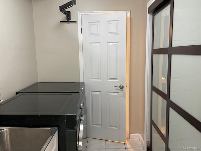 21150 E Chigwidden St, Northville, MI 48167 - laundry room with washing machine and clothes dryer and light tile patterned flooring