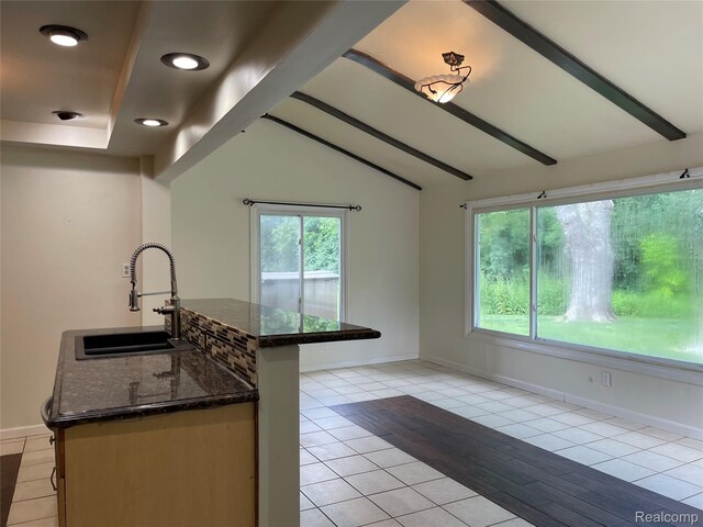 21150 E Chigwidden St, Northville, MI 48167 - kitchen with dark stone countertops, light tile patterned flooring, and recessed lighting