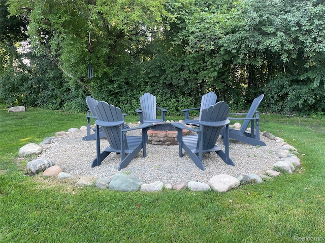 21150 E Chigwidden St, Northville, MI 48167 - view of grassy yard featuring a fire pit