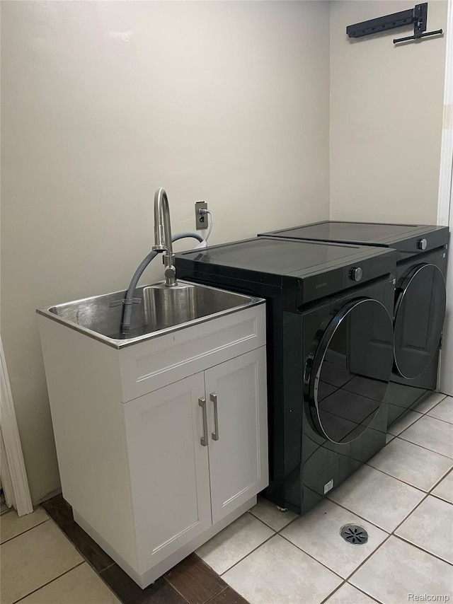21150 E Chigwidden St, Northville, MI 48167 - laundry room featuring washer and clothes dryer and light tile patterned floors