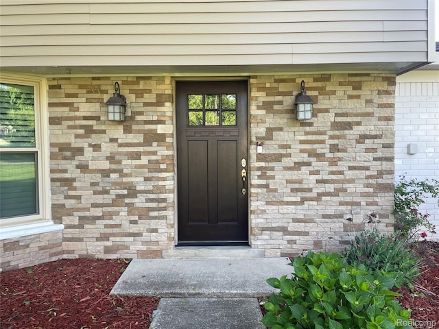 21150 E Chigwidden St, Northville, MI 48167 - doorway to property featuring brick siding