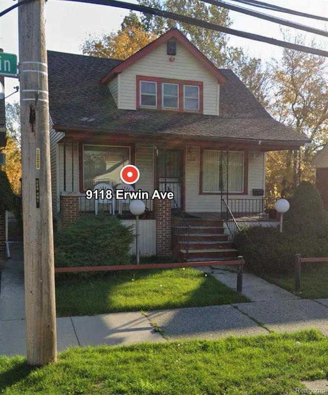 9118 Erwin St, Detroit, MI 48213 - bungalow-style house with a porch and roof with shingles