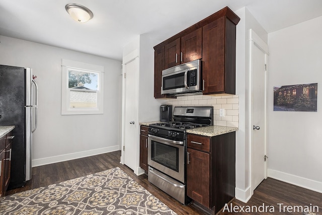 1602 4th St NW, Grand Rapids, MI 49504 - kitchen with stainless steel appliances, dark wood-type flooring, and dark brown cabinets