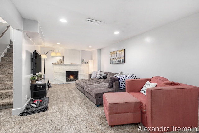 1602 4th St NW, Grand Rapids, MI 49504 - living area featuring stairway, carpet floors, a fireplace, and recessed lighting
