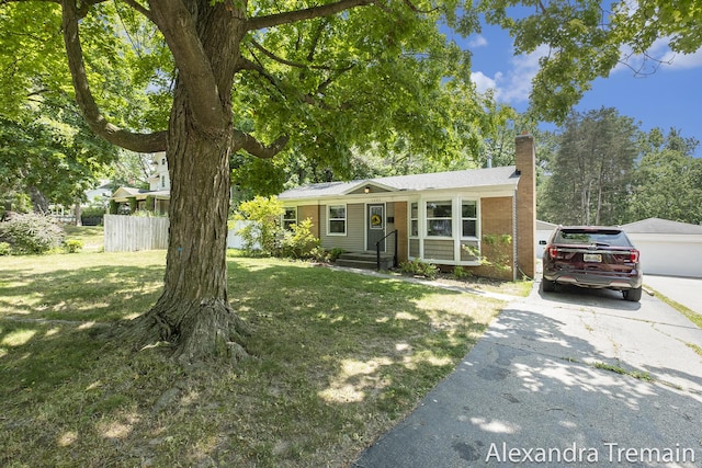 1602 4th St NW, Grand Rapids, MI 49504 - ranch-style home with a chimney