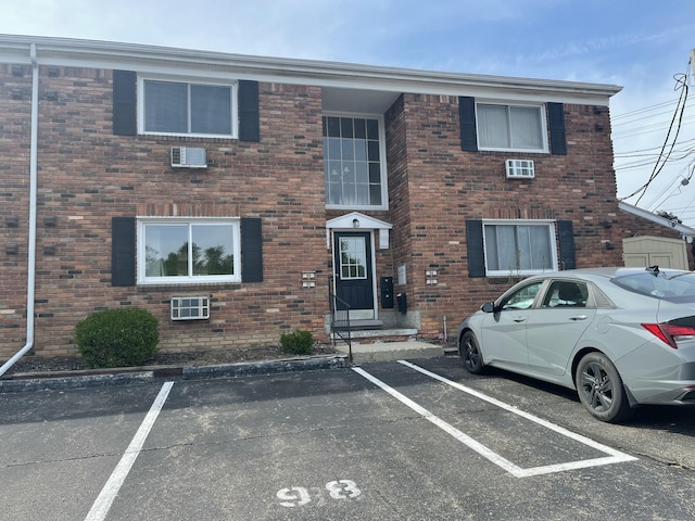 31831 Grand River Ave Unit 96, Farmington, MI 48336 - townhome / multi-family property featuring uncovered parking and brick siding