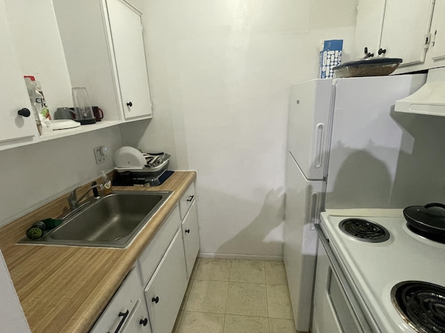 31831 Grand River Ave Unit 96, Farmington, MI 48336 - kitchen with extractor fan, white cabinets, light countertops, and stove