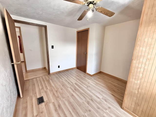 801 S 1st St, Buckley, MI 49620 - unfurnished bedroom featuring light wood-style floors, ceiling fan, and a closet