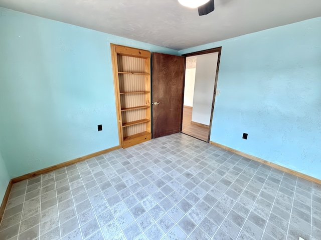801 S 1st St, Buckley, MI 49620 - unfurnished bedroom with baseboards
