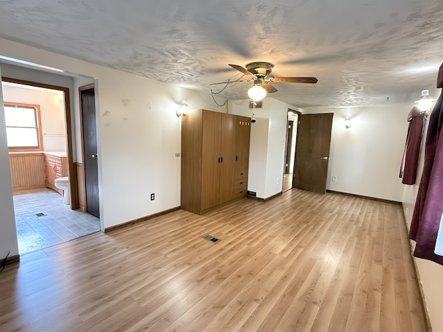 801 S 1st St, Buckley, MI 49620 - empty room with light wood-type flooring and a ceiling fan