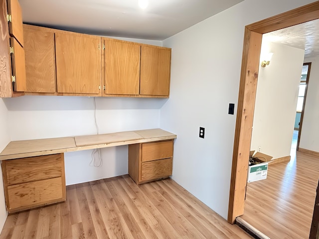 801 S 1st St, Buckley, MI 49620 - unfurnished office with built in desk and light wood-style floors