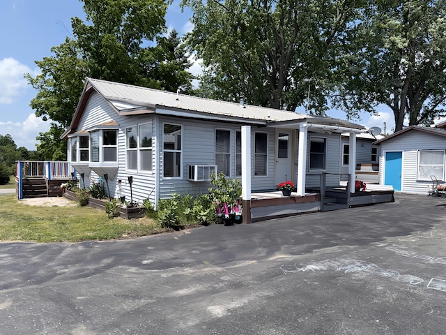801 S 1st St, Buckley, MI 49620 - view of front of property featuring a metal roof and a shed