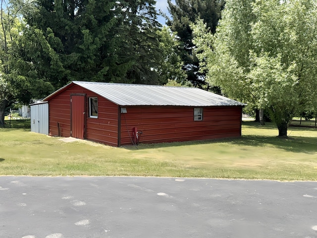 801 S 1st St, Buckley, MI 49620 - view of pole building with a yard