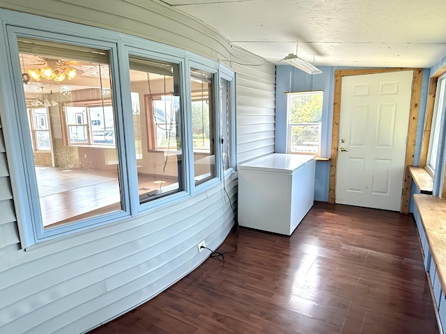 801 S 1st St, Buckley, MI 49620 - unfurnished sunroom with plenty of natural light, a chandelier, and lofted ceiling