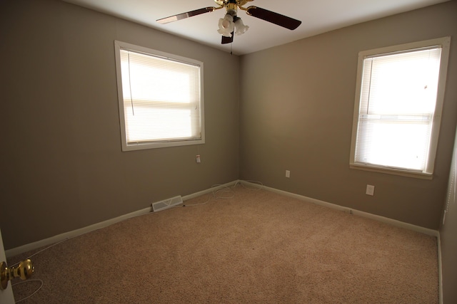 24352 Powers Ave, Dearborn Heights, MI 48125 - carpeted empty room with healthy amount of natural light and a ceiling fan