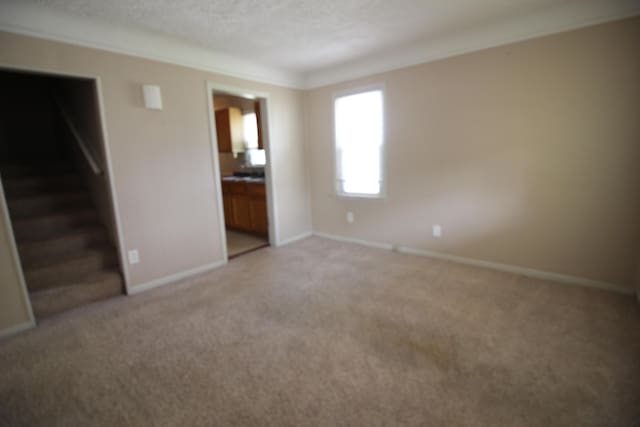24352 Powers Ave, Dearborn Heights, MI 48125 - spare room with light carpet and stairs