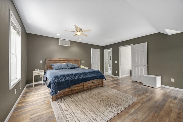 21008 Tamarack Rd, Howard City, MI 49329 - bedroom featuring wood finished floors, multiple windows, lofted ceiling, a ceiling fan, and recessed lighting