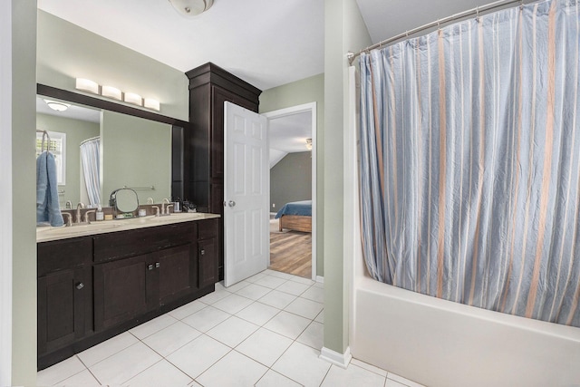 21008 Tamarack Rd, Howard City, MI 49329 - ensuite bathroom featuring tile patterned flooring, double vanity, and shower / bath combo with shower curtain