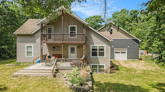 21008 Tamarack Rd, Howard City, MI 49329 - back of property featuring a lawn, a balcony, a wooden deck, and a shingled roof