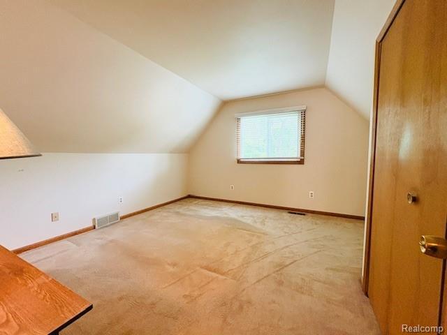 11638 Alois St, Livonia, MI 48150 - additional living space featuring carpet floors and lofted ceiling