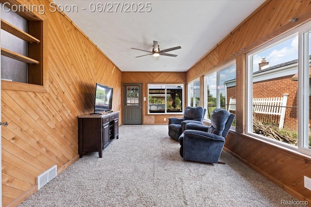 1059 Kenilworth Pl, Clawson, MI 48017 - living room featuring wood walls, carpet floors, plenty of natural light, and ceiling fan