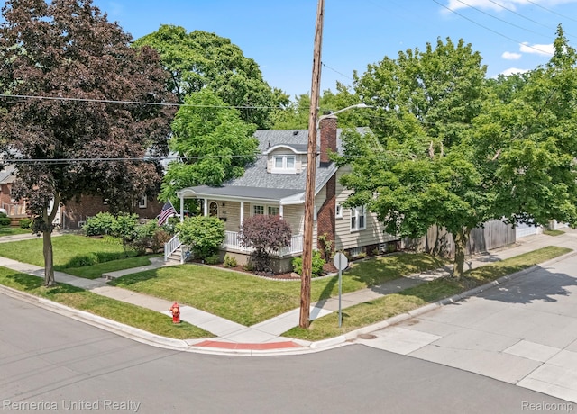535 S Edison Ave, Royal Oak, MI 48067 - view of front facade featuring a chimney, a front lawn, and a porch