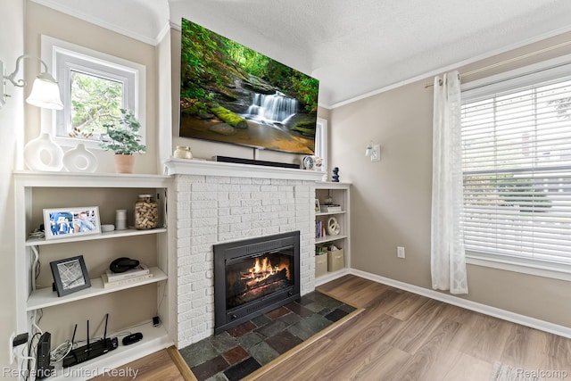 535 S Edison Ave, Royal Oak, MI 48067 - living area with a fireplace, wood finished floors, ornamental molding, and a textured ceiling