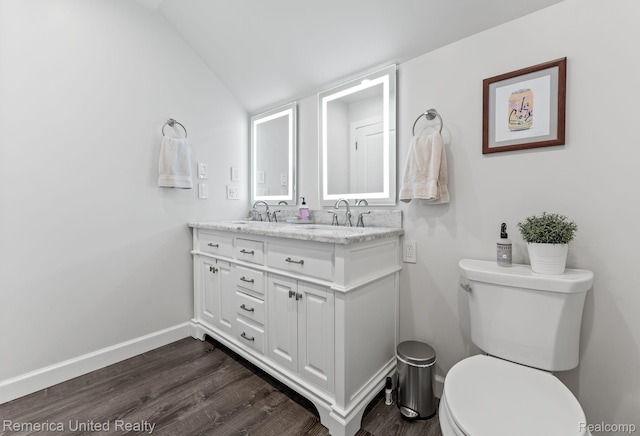 535 S Edison Ave, Royal Oak, MI 48067 - bathroom featuring wood finished floors, double vanity, and lofted ceiling
