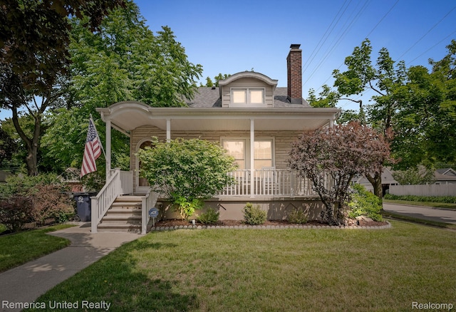 535 S Edison Ave, Royal Oak, MI 48067 - bungalow-style home with a porch, a front lawn, and a chimney