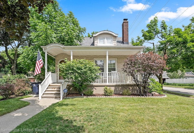 535 S Edison Ave, Royal Oak, MI 48067 - bungalow-style house featuring a porch, a front yard, and a chimney