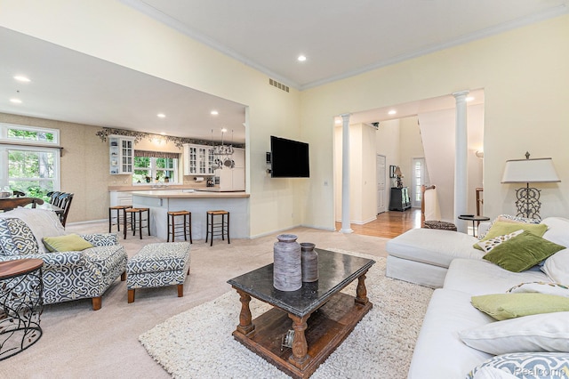 6155 Carey Rd, Commerce Twp, MI 48382 - living area featuring decorative columns, crown molding, and recessed lighting
