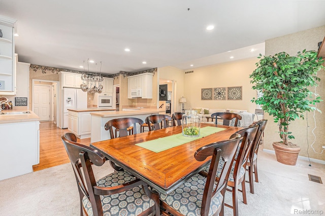 6155 Carey Rd, Commerce Twp, MI 48382 - dining space featuring light carpet and recessed lighting