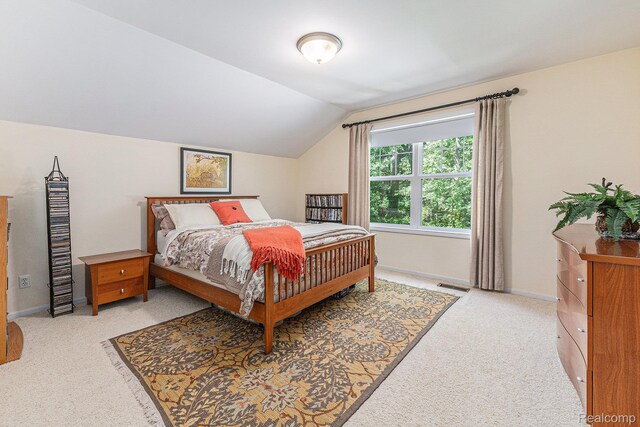 6155 Carey Rd, Commerce Twp, MI 48382 - bedroom with light carpet and vaulted ceiling