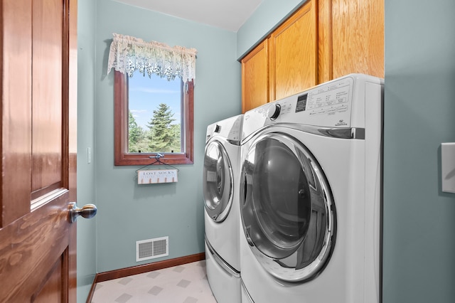64670 Windrose Way, Lawton, MI 49065 - washroom featuring cabinet space, washer and clothes dryer, and light floors