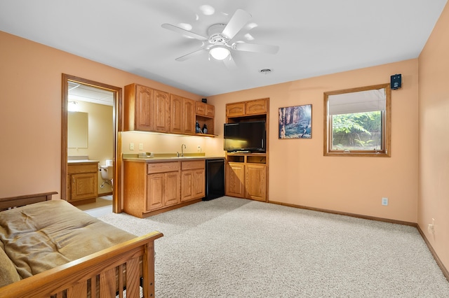 64670 Windrose Way, Lawton, MI 49065 - kitchen with light carpet, a ceiling fan, dishwasher, light countertops, and brown cabinetry