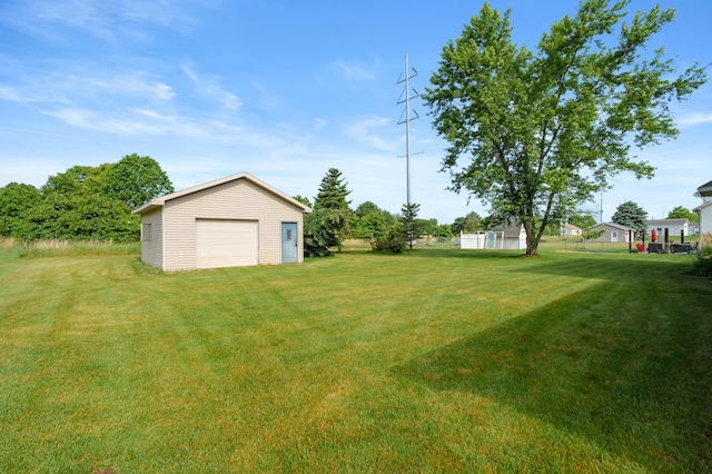 64670 Windrose Way, Lawton, MI 49065 - view of grassy yard with a detached garage and an outbuilding