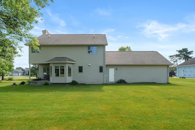 64670 Windrose Way, Lawton, MI 49065 - back of property featuring a yard, a patio, and a chimney