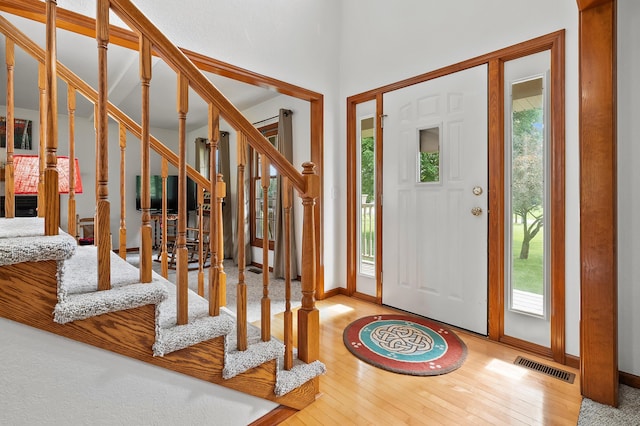 64670 Windrose Way, Lawton, MI 49065 - foyer with healthy amount of natural light, stairway, and hardwood / wood-style floors