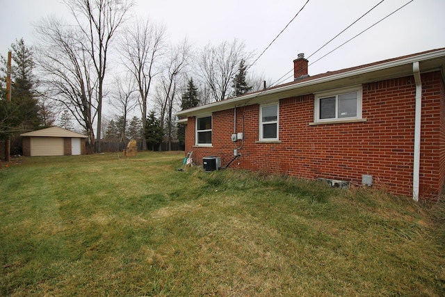 3816 Pokley Ct, Sterling Heights, MI 48310 - view of grassy yard featuring a storage unit
