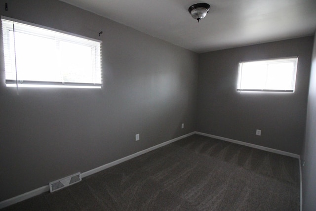 3816 Pokley Ct, Sterling Heights, MI 48310 - unfurnished room featuring dark colored carpet and baseboards