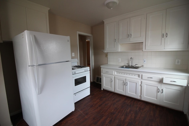 573 Leblanc St, Lincoln Park, MI 48146 - kitchen featuring white appliances, dark wood-style floors, tasteful backsplash, light countertops, and white cabinetry