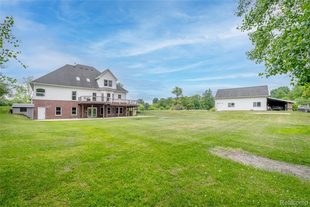 12462 Lillie Rd, Byron, MI 48418 - view of green lawn with a deck and an outdoor structure