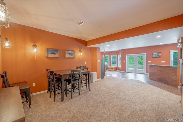 12462 Lillie Rd, Byron, MI 48418 - carpeted dining space with french doors, healthy amount of natural light, and recessed lighting