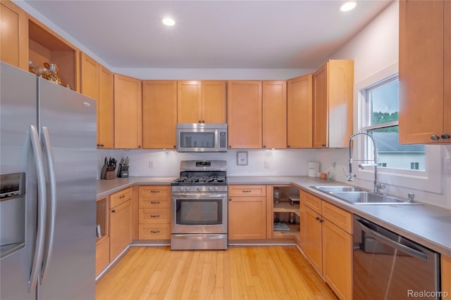 12462 Lillie Rd, Byron, MI 48418 - kitchen with appliances with stainless steel finishes, light wood-style flooring, open shelves, light countertops, and recessed lighting