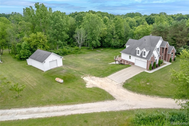12462 Lillie Rd, Byron, MI 48418 - aerial view of property and surrounding area featuring a heavily wooded area