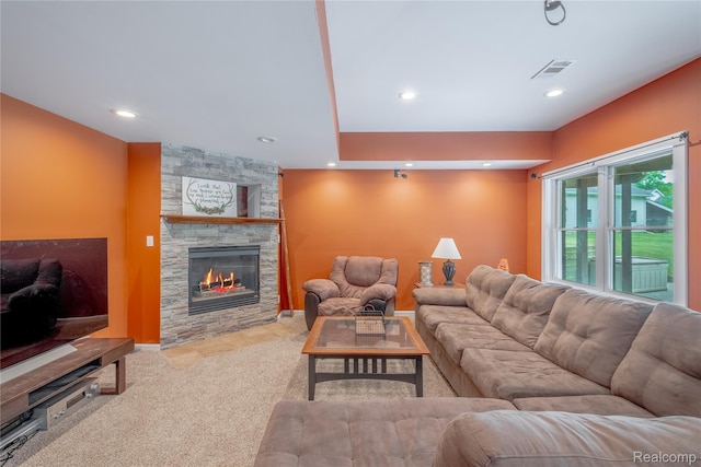 12462 Lillie Rd, Byron, MI 48418 - living area featuring a stone fireplace, carpet flooring, and recessed lighting