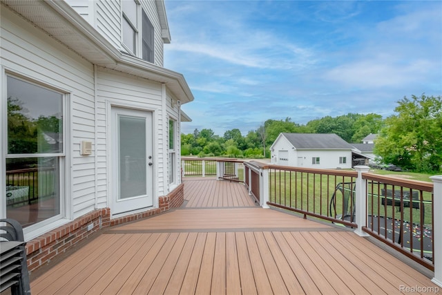 12462 Lillie Rd, Byron, MI 48418 - wooden deck featuring view of scattered trees and a lawn