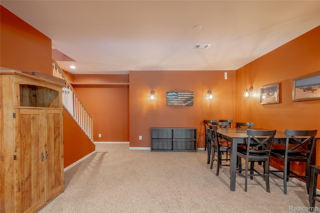 12462 Lillie Rd, Byron, MI 48418 - carpeted dining room with stairs and baseboards
